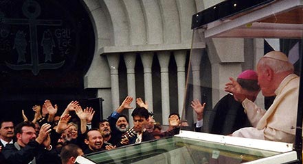 Pope John Paul II waving to bystanders